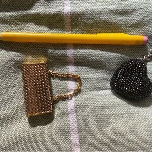 Gold Chain Mini Purse Keychain with natural pink lip gloss, $25 for each item.